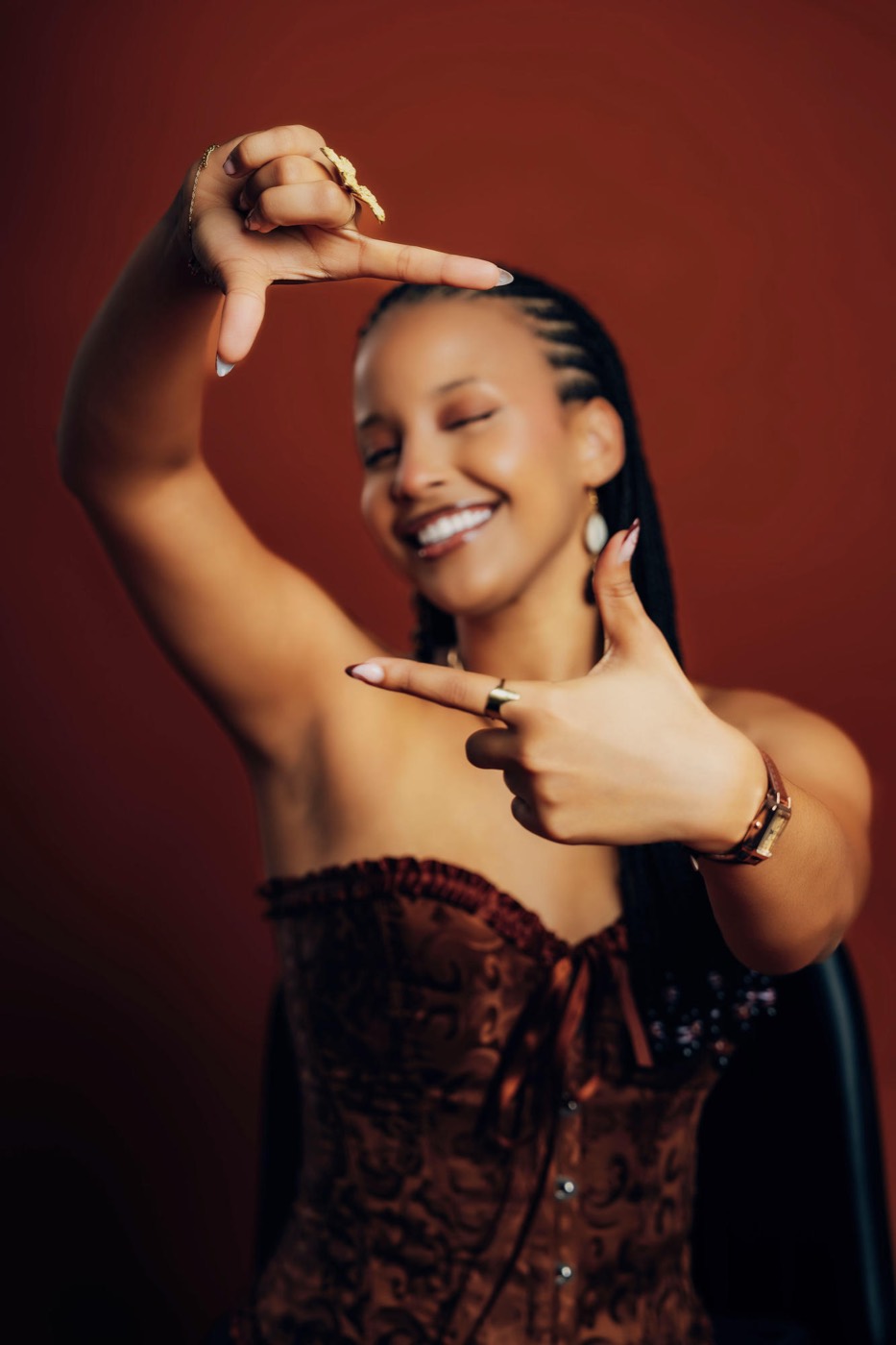 Marlène framing her face with her hands